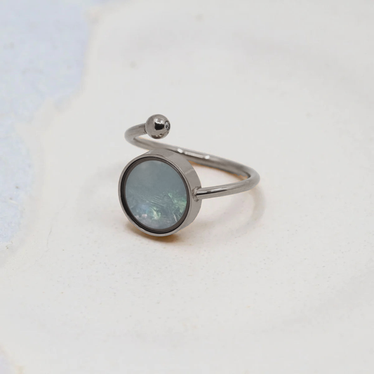 The Oli&J adjustable ring in bare 316 stainless steel, its round bezel ready for a stone