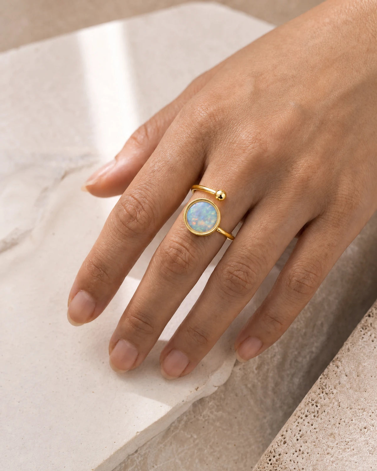 Australian Opal Adjustable Ring in yellow gold, worn on the hand