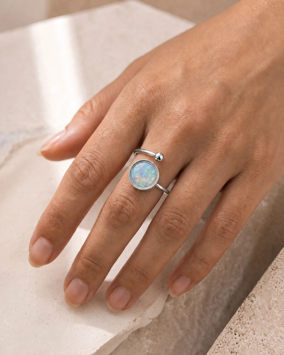 Australian Opal Adjustable Ring in stainless steel, worn on the hand